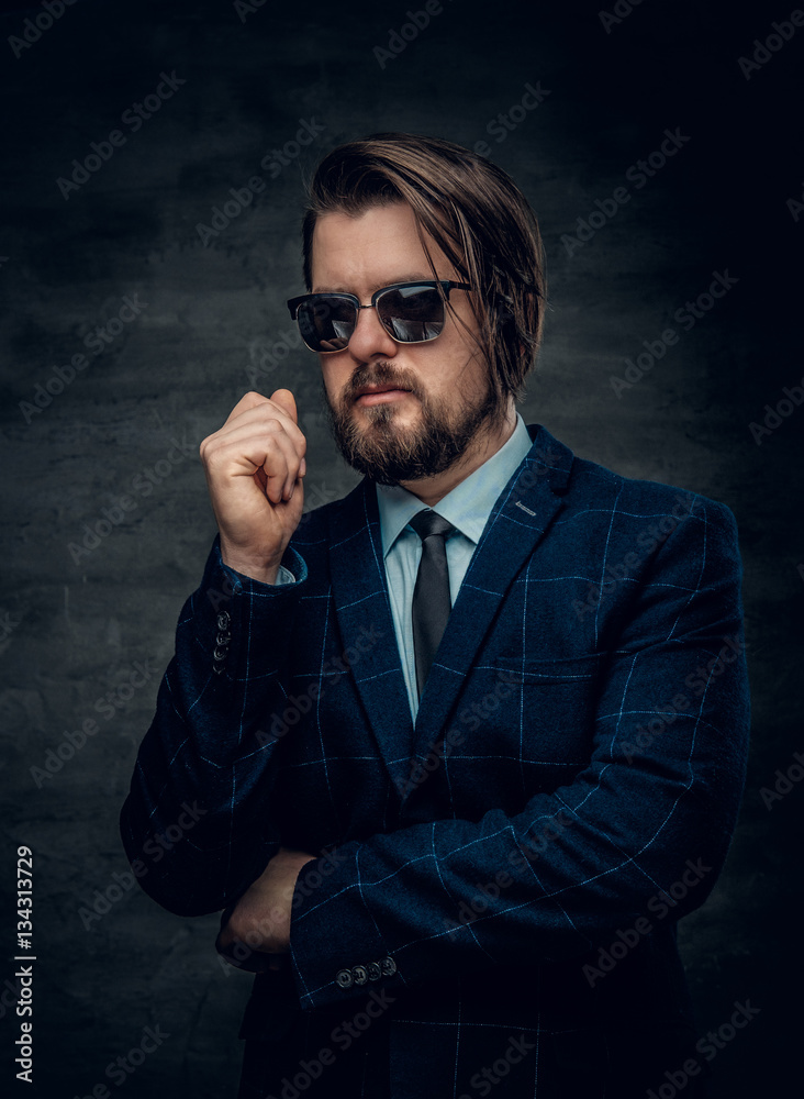 Fototapeta premium A man in a suit and sunglasses.