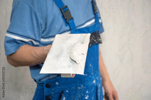 Hands plasterer at work
