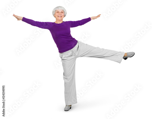 happy charming beautiful elderly woman doing exercises while working out playing sports. On a white background