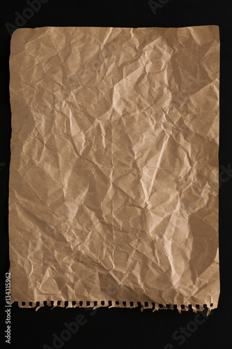 old paper sheet isolated on black background