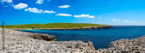 Cala des Talaier beach sea cove in sunny day, Menorca island, Sp