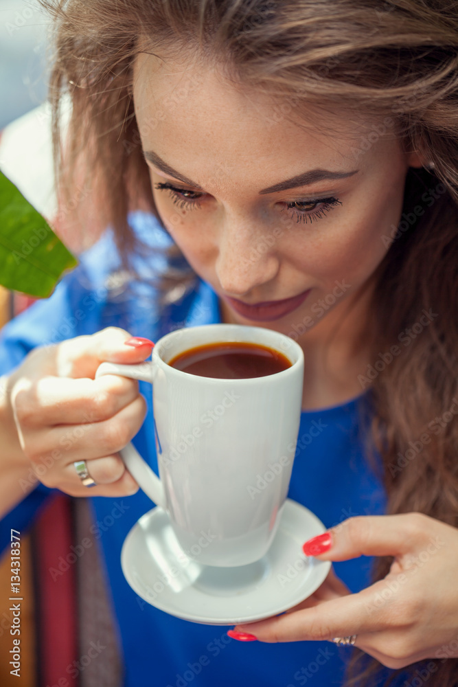 Beautiful woman drinking coffe in the cafe Beautiful woman drinking coffe in the cafe