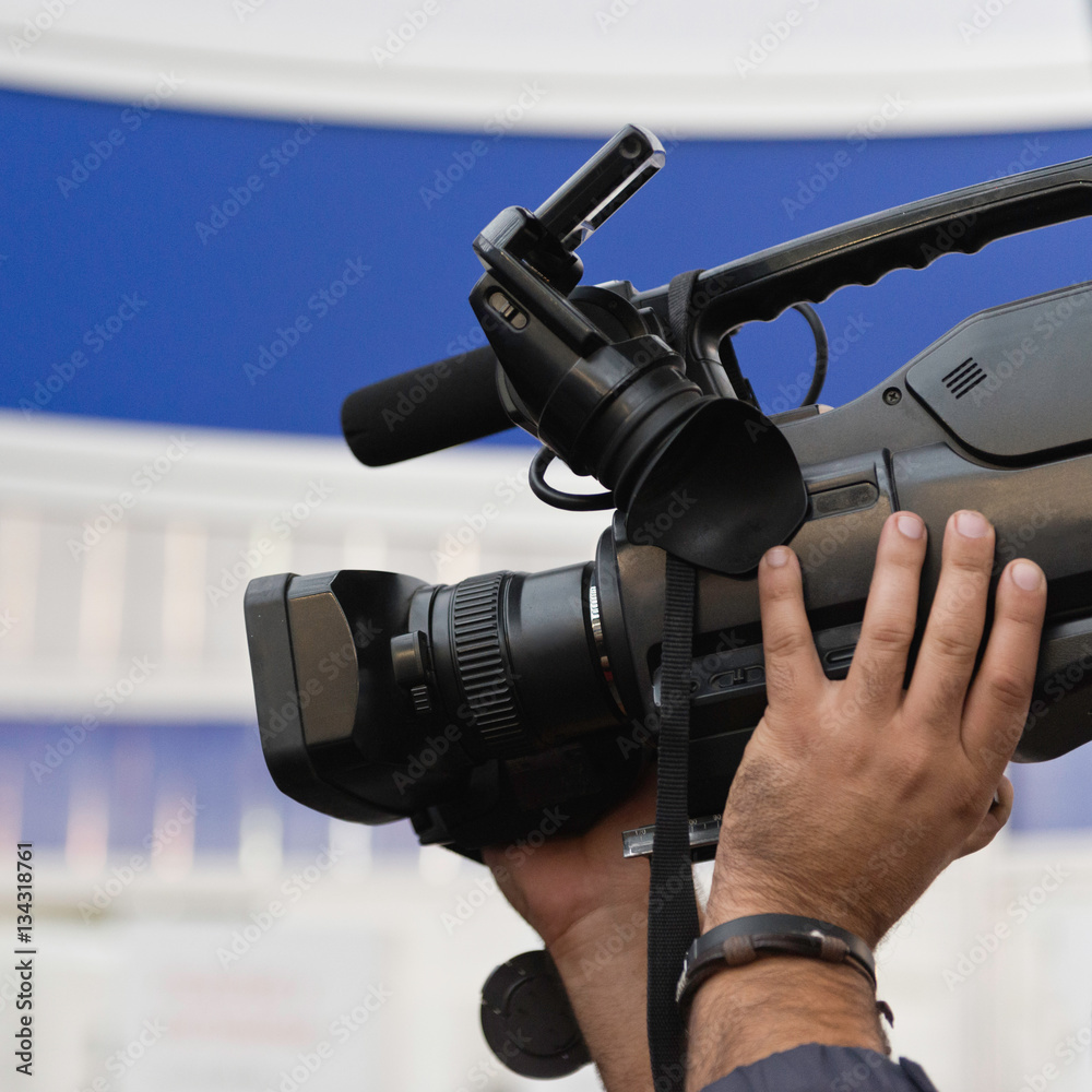Cameraman holding video camera