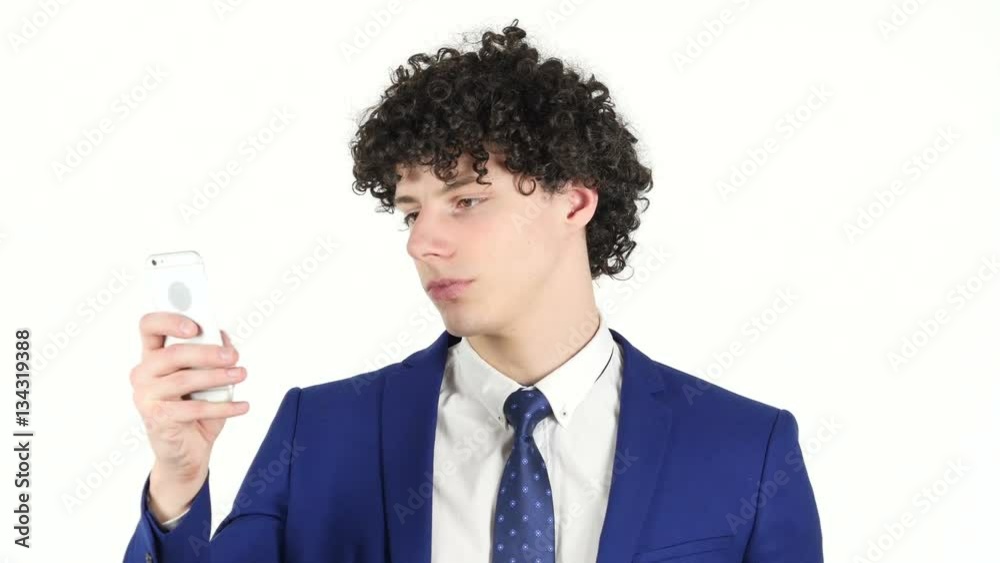 Young Businessman Typing Text on Smartphone