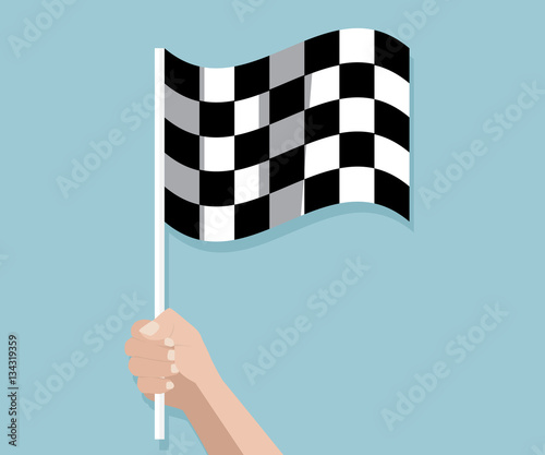 hand holding checkered race finish flag