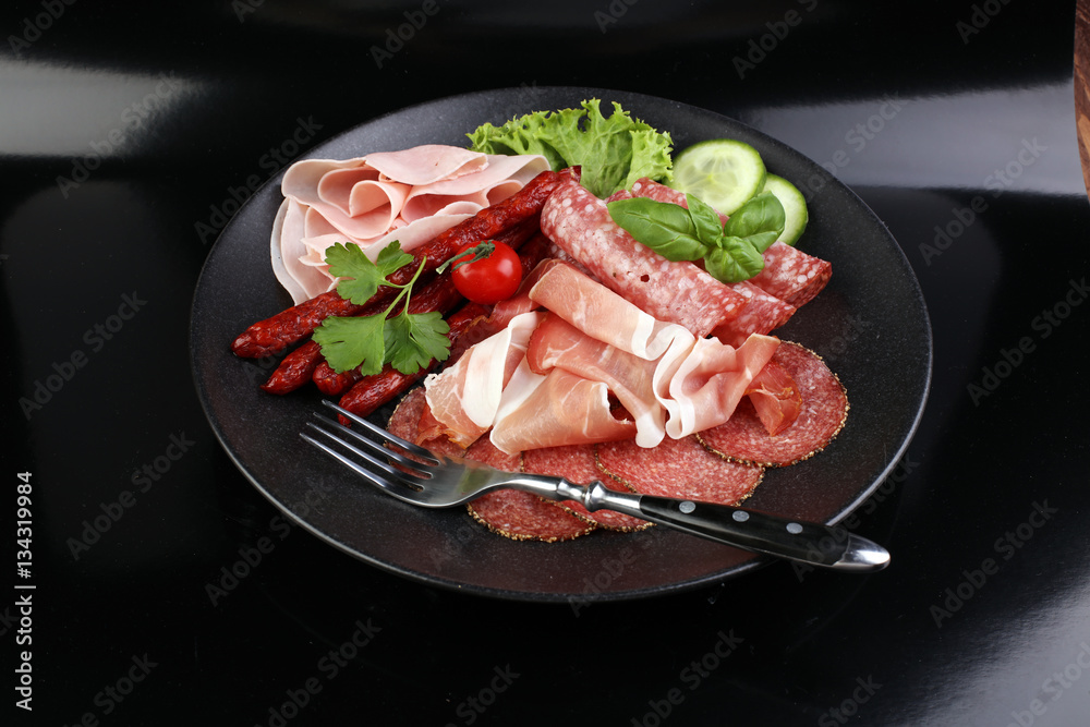 Food tray with delicious salami, pieces of sliced ham, sausage, Food tray with delicious salami, pieces of sliced ham, sausage,