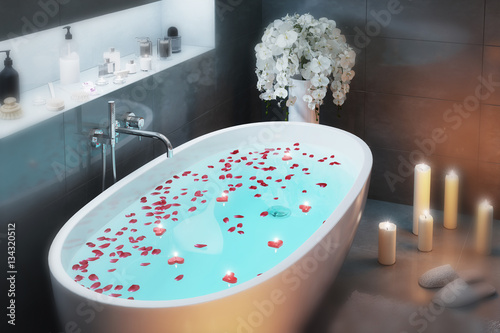 Romantic bath with candles in the evening in focus