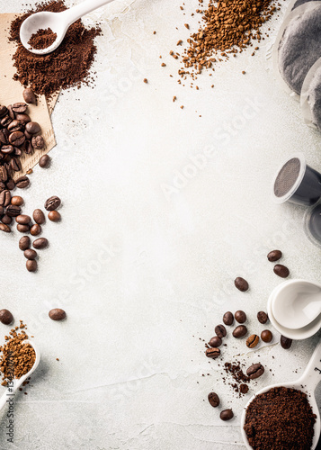 Background with assorted coffee, coffee beans, ground and instant, pads and capsules, retro slyle toned, copy space, top view.