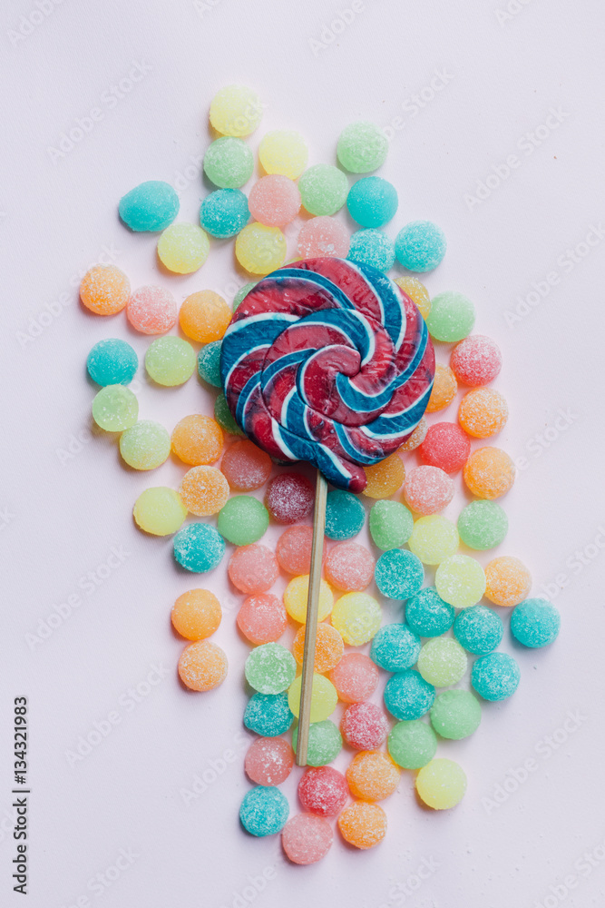 lollipop with candies on pink background, unhealthy junk food lollipop with candies on pink background, unhealthy junk food