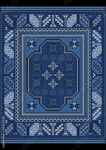 Vintage carpet with ethnic ornament in blue and bluish shades
