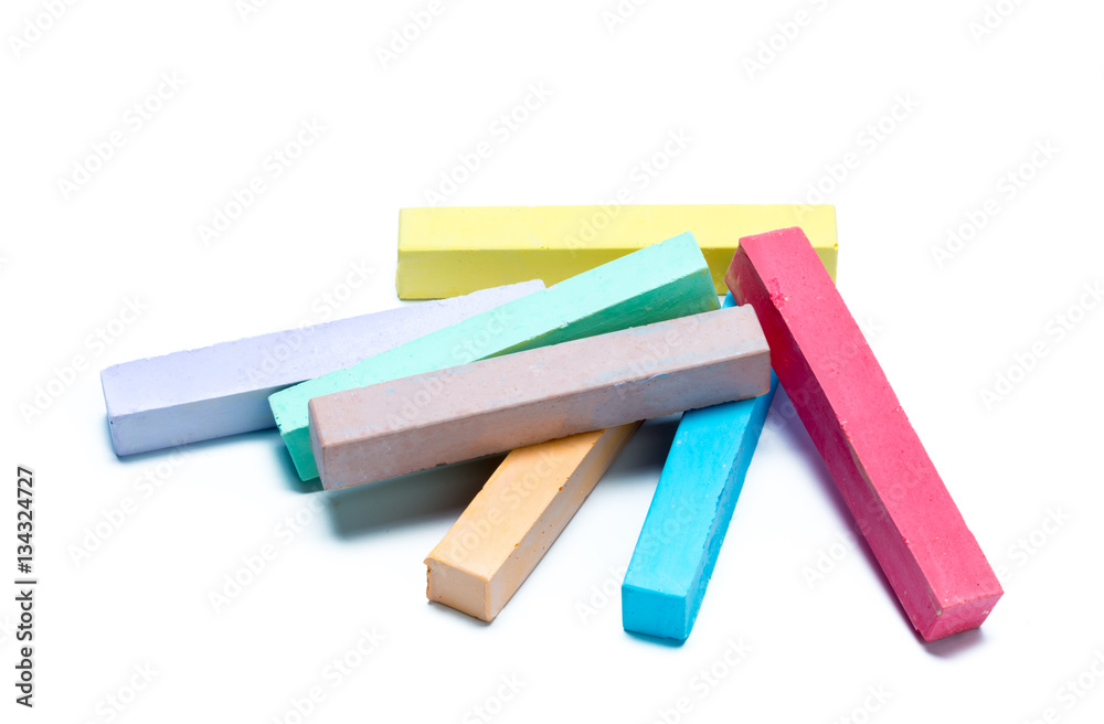 chalks in a variety of colors arranged on a white background chalks in a variety of colors arranged on a white background