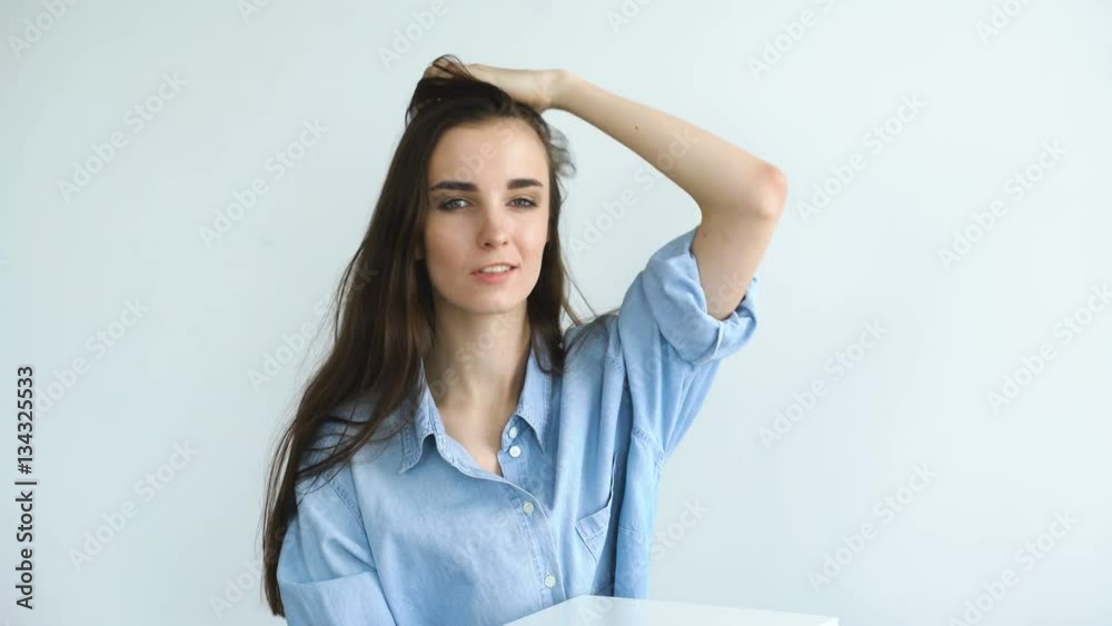 Professional fashion model posing and looking into camera. Woman show poses and emotions Professional fashion model posing and looking into camera. Woman show poses and emotions