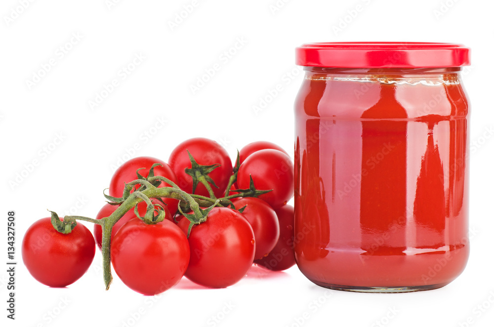 Glass jar with tomato paste and cherry tomatoes Glass jar with tomato paste and cherry tomatoes