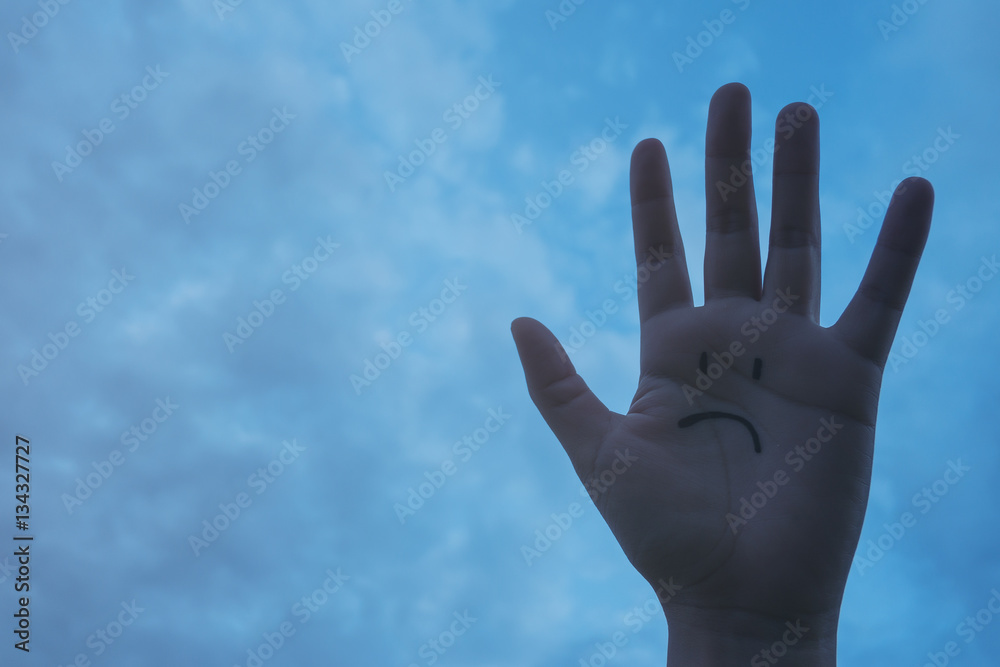 Sad face on hand with a hopeless feeling Sad face on hand with a hopeless feeling