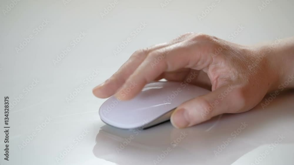 Close-up of female hand using white mouse Close-up of female hand using white mouse