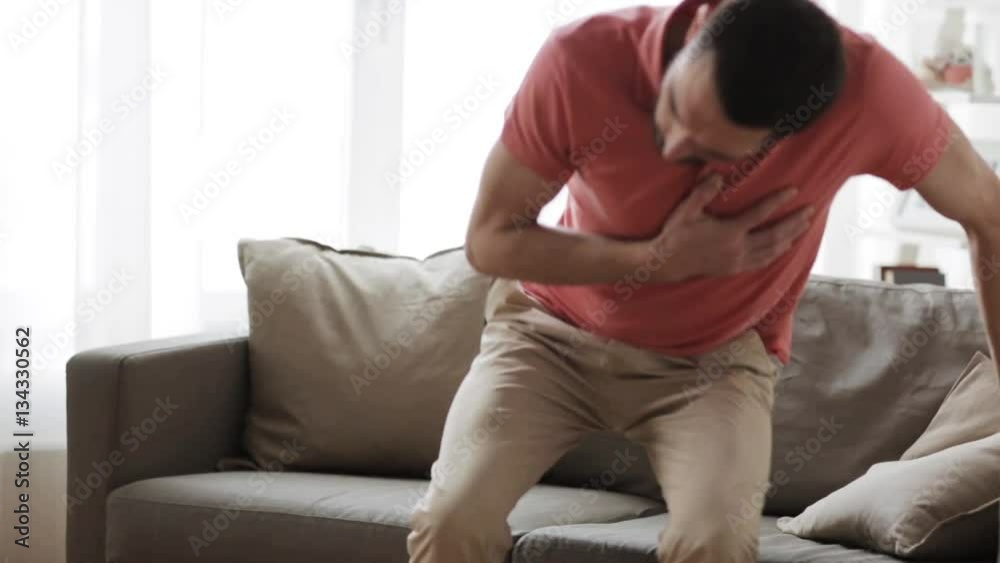 unhappy man suffering from heart ache at home