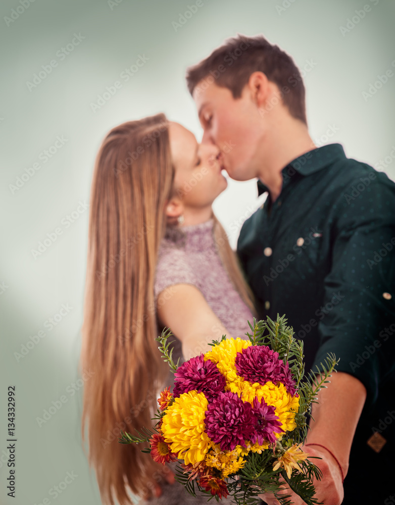 Kissing couple with flowers Kissing couple with flowers