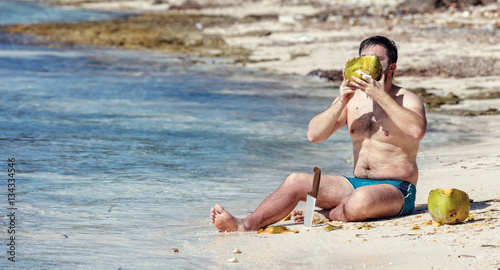 Fényképezés Robinson and coconut. survival on a desert island