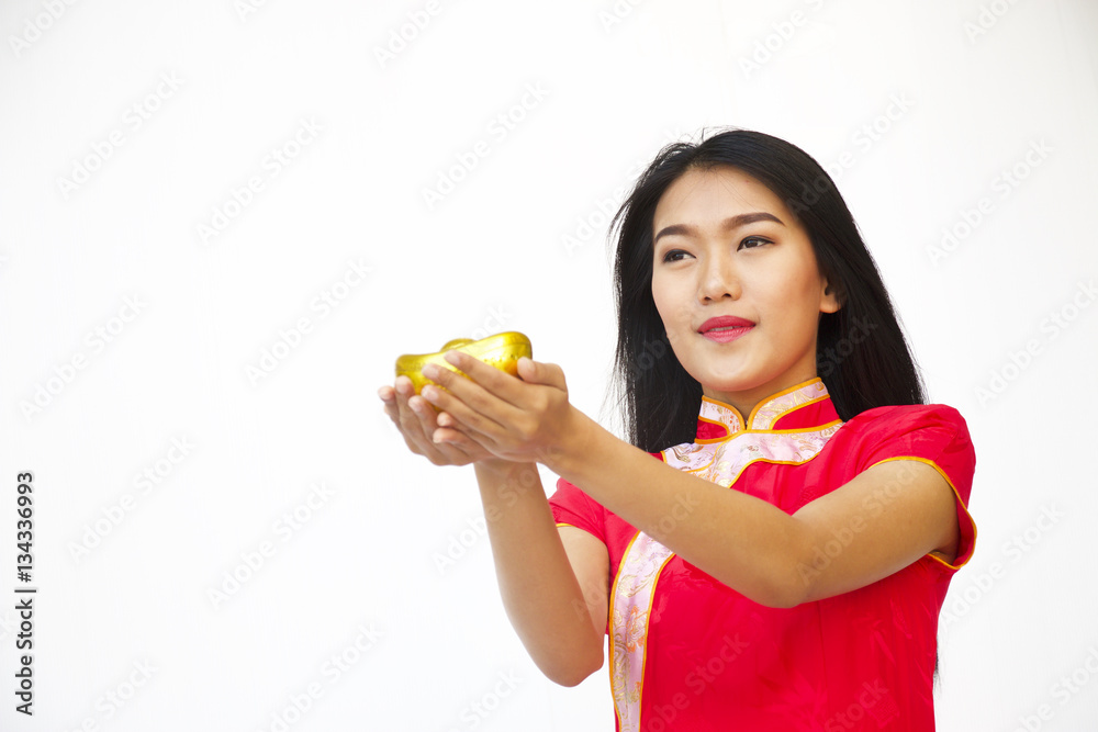 Chinese woman is holding gold ingot in hand. Chinese woman is holding gold ingot in hand.