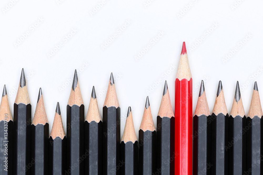 Red pencil standing out from crowd of plenty identical fellows Red pencil standing out from crowd of plenty identical fellows