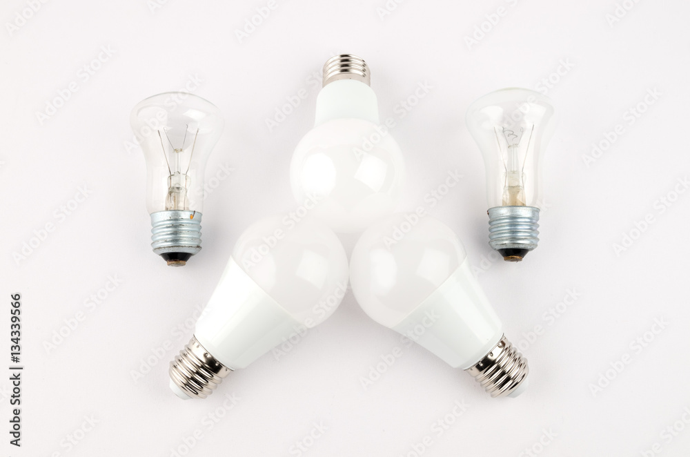 several LED energy saving light bulbs over the old incandescent, use of economical and environmentally friendly light bulb concept several LED energy saving light bulbs over the old incandescent, use of economical and environmentally friendly light bulb concept
