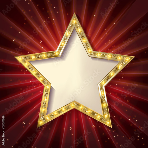 Gold star on a dark background.