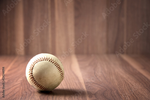 Old Vintage Baseball on wood background