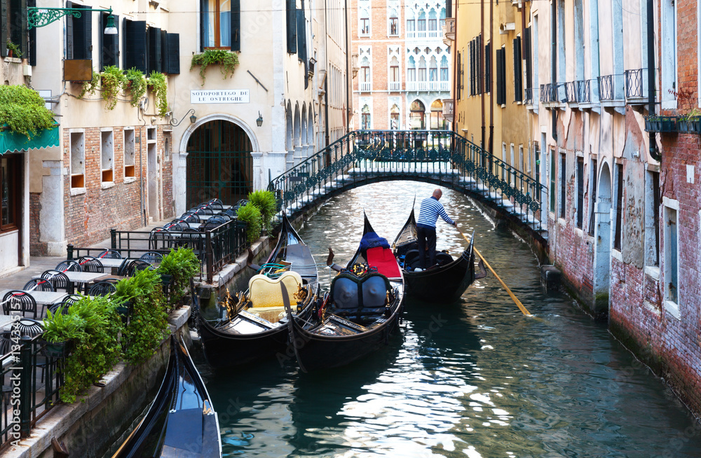 Venice. Traditional gondolas on the canals in the San Marco district