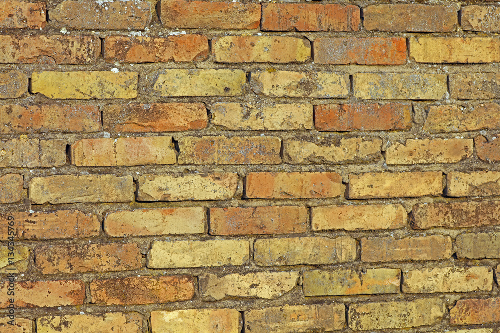 Obraz premium Hauswand Steinmauer aus Ziegelsteinen