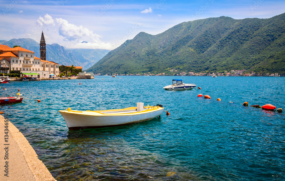 beautiful mediterranean landscape. Mountains and fishing boats near town Perast, near town Perast, Kotor bay (Boka Kotorska), Montenegro, Europe