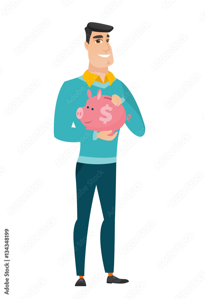 Caucasian business man holding a piggy bank.