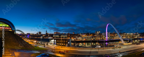 Newcastle Quayside Panorama at night, on the banks of the River Tyne, with its famous bridges and Newcastle upon Tyne skyline beyond
