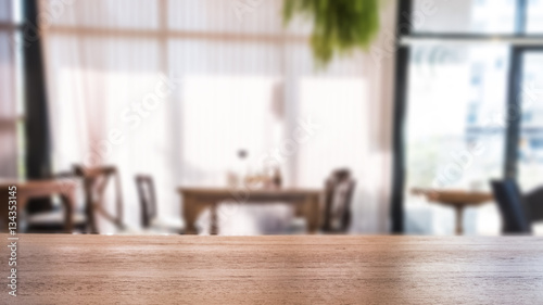 background of wood table with blurred view of cafe