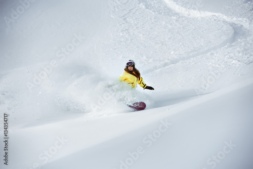 Girl snowboarder off-piste backcountry freeriding
