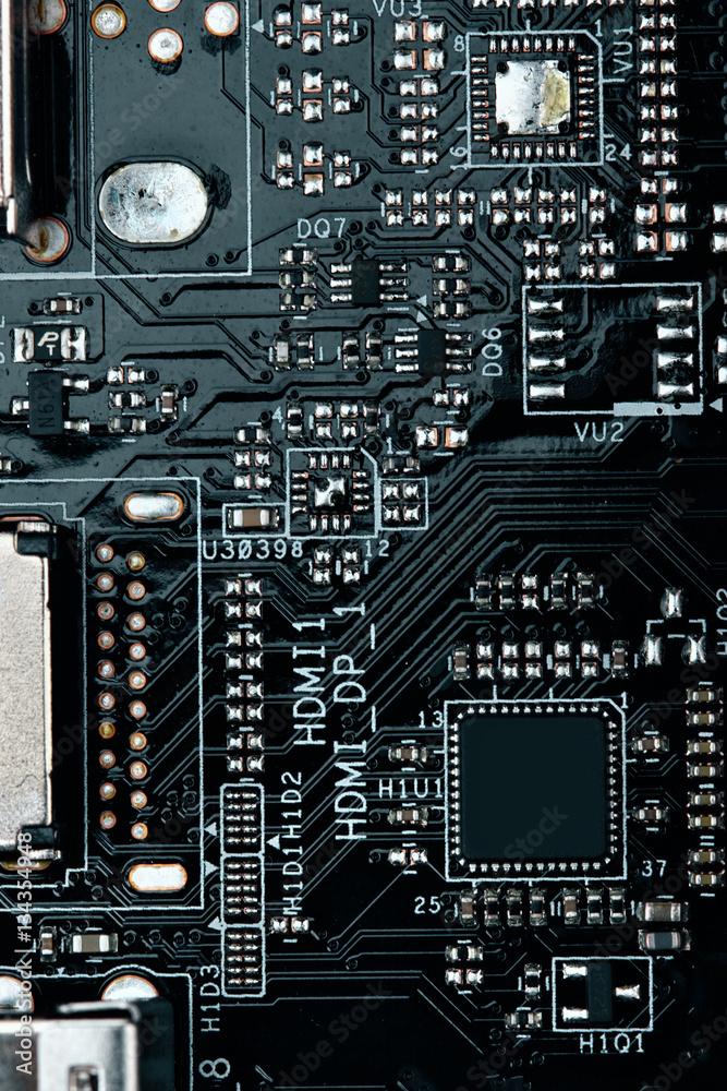 Fototapeta premium Integrated semiconductor microchip microprocessor on blue circuit board representative of the high tech industry and computer science.macro.concept compute harware