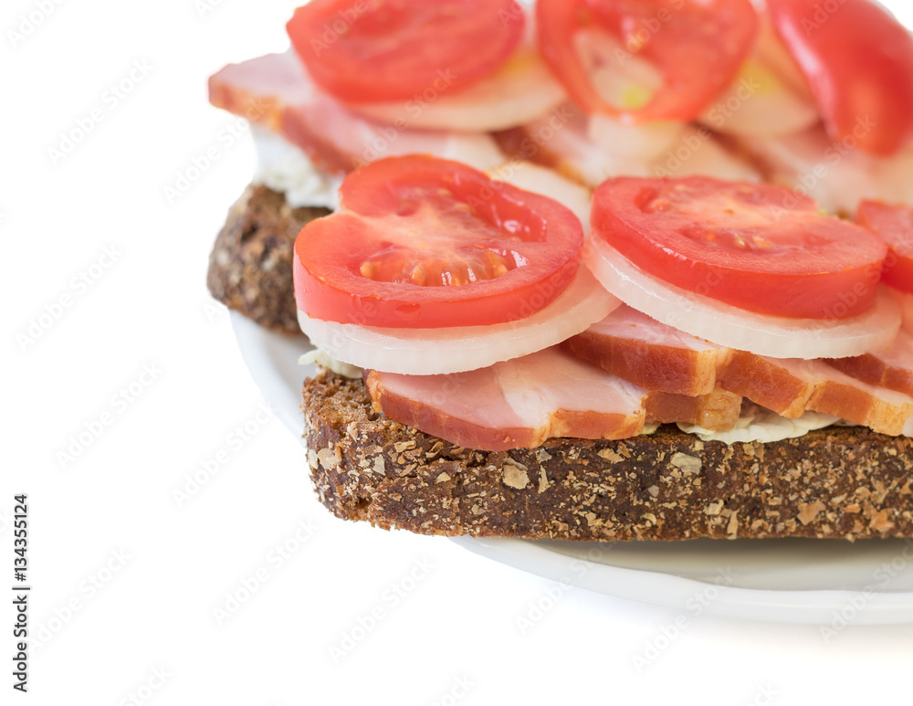 Sandwich with ham, tomato, onion and lettuce. Sandwich with ham, tomato, onion and lettuce.