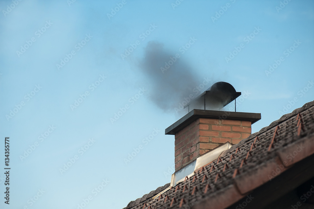 Chimney with a smoke coming out. Chimney with a smoke coming out.