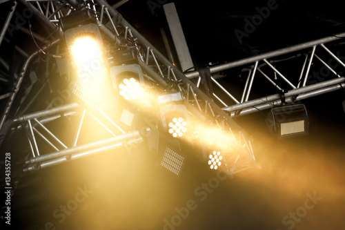 stage spotlights through smoke photo