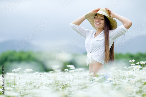Woman in a field with flowers 
