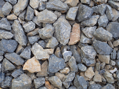 Crushed grey stone on the ground texture background