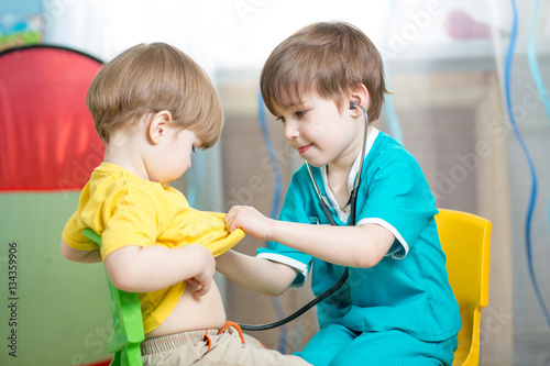 Kids playing doctor in play...