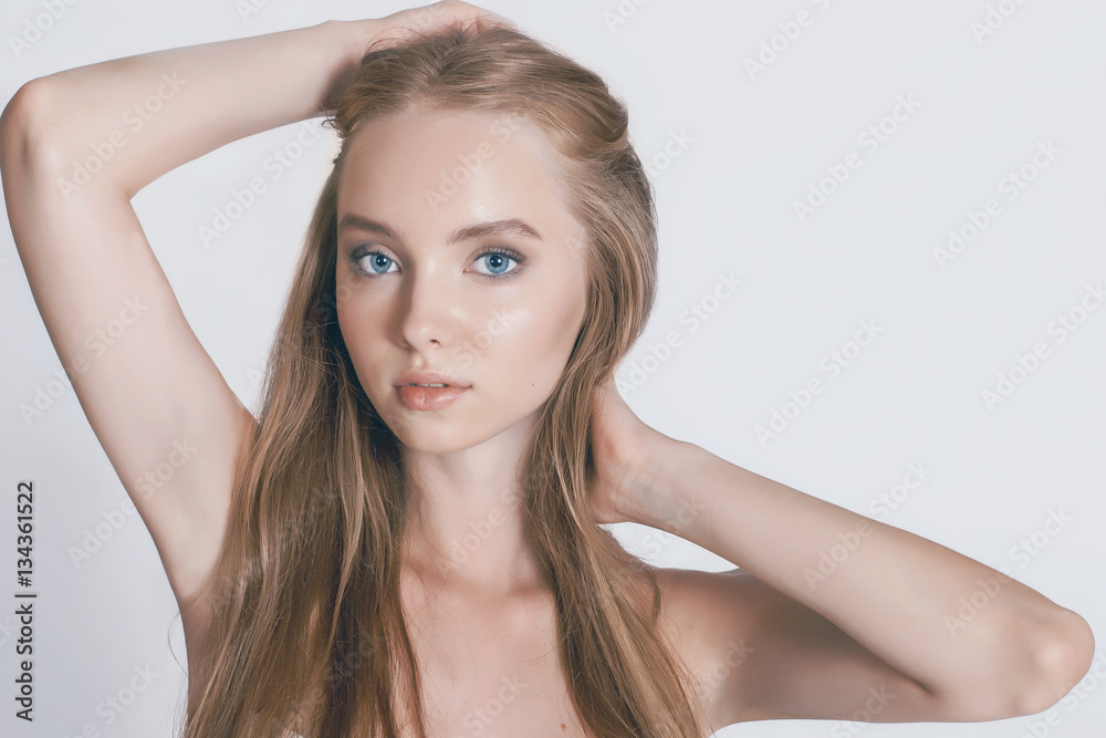 beautiful young girl with long hair posing in the studio beautiful young girl with long hair posing in the studio