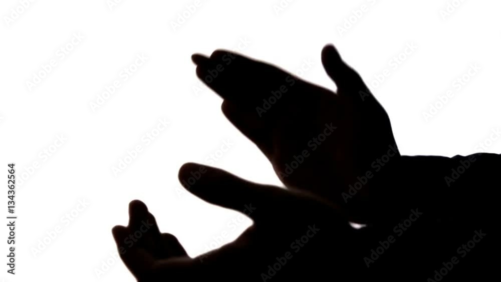 dark silhouette of male hands clapping, applause dark silhouette of male hands clapping, applause