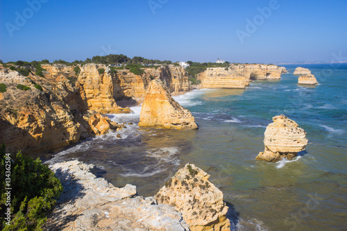 Close up of art stone in Marinha beach, on the Atlantic coast in Portugal,Algarve in summer background.