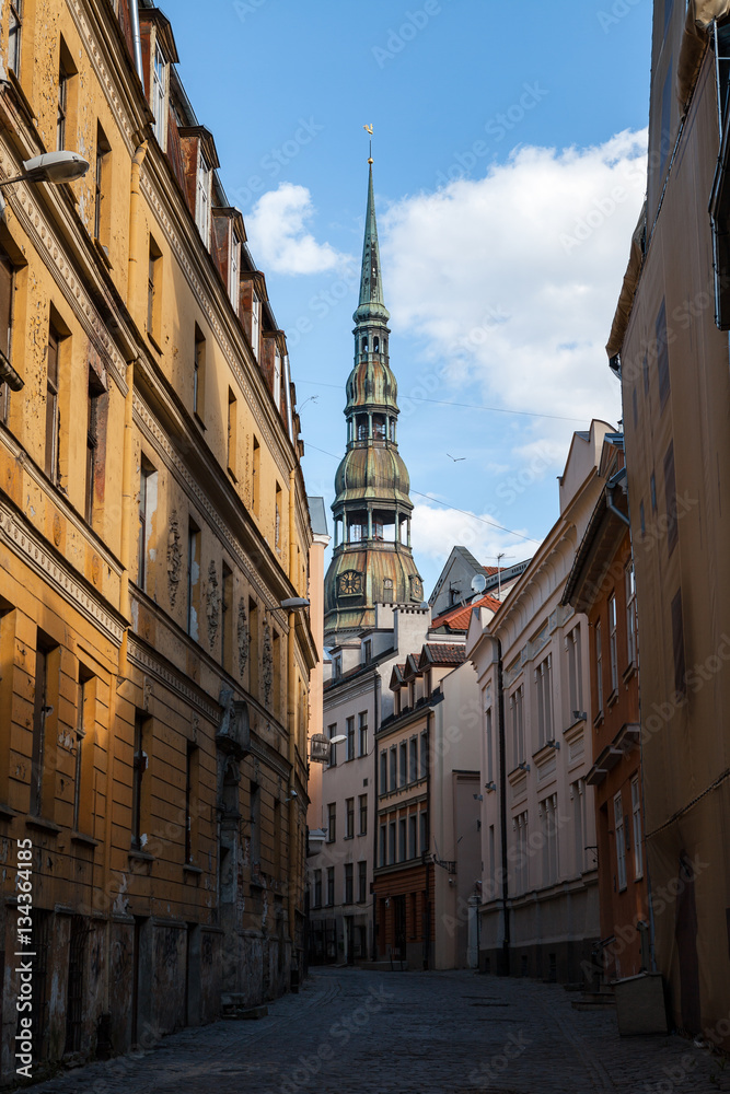 Narrow street up to St. Peter church. Riga, Latvia.