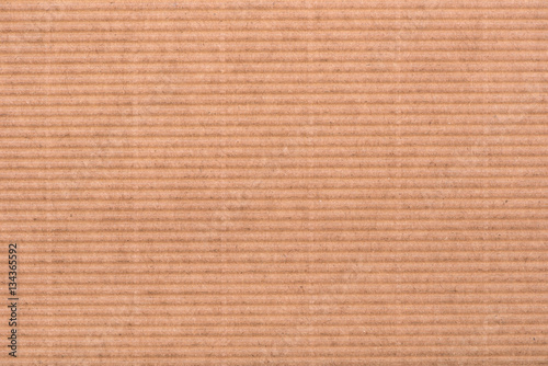 Cardboard background. Abstract brown background of paper, cardboard texture.