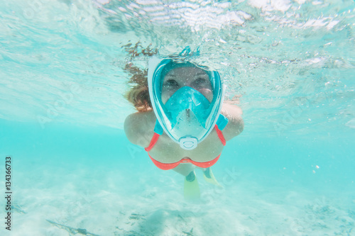 Woman snorkeling underwater in Indian Ocean, Maldives