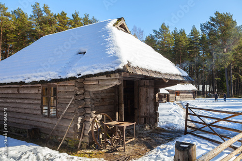 Traditional wooden cottage, baltic and scandinavian style. Winter scene in the countryside. © yegorov_nick