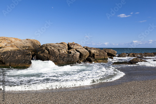 Beach with cliffs in Costa del Sol and a flood photo