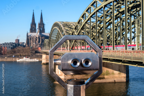 Cologne Cathedral and Hohenzollern Bridge. In the foreground of public Binocular Telescope. © oktober64